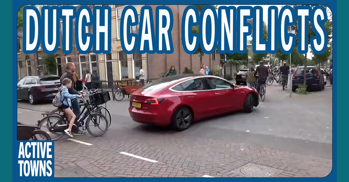 Children trying to ride to school with cars blocking the street