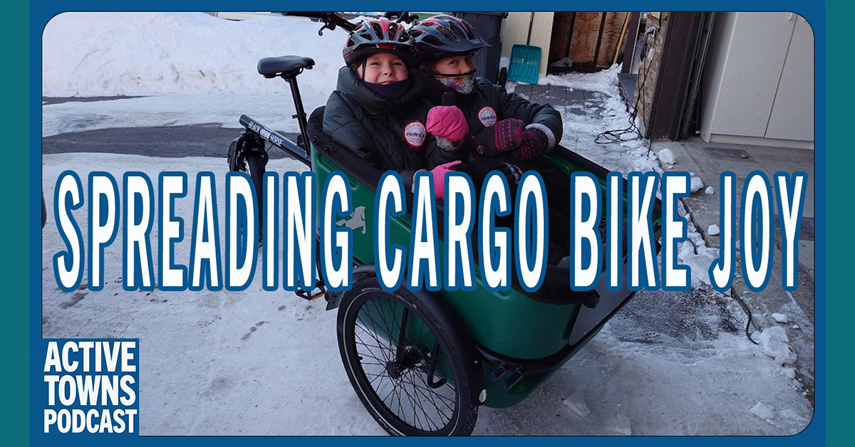 Two small children in a front bucket-style cargo trike